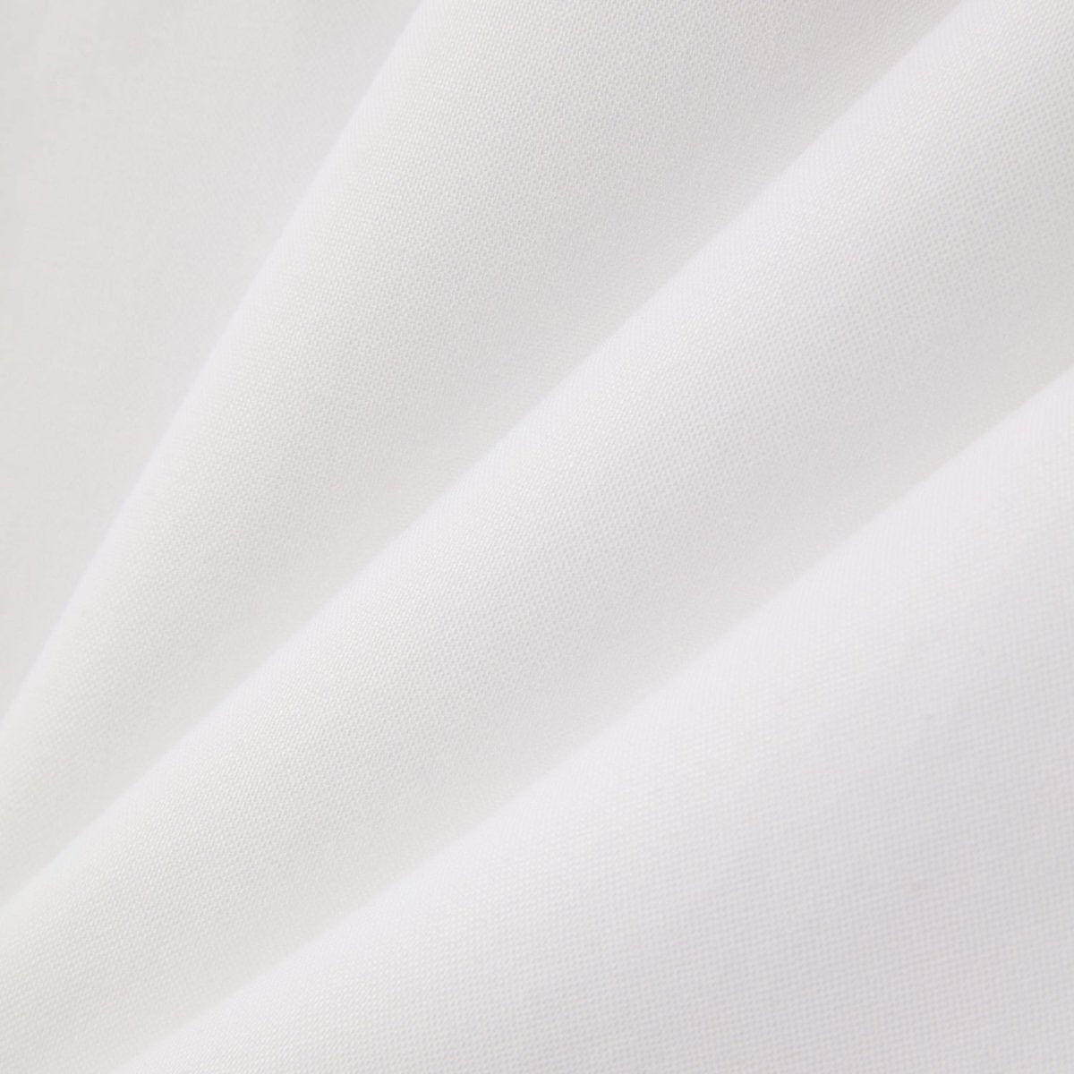 Close-up of white fabric texture of Giordano wrinkle free cotton shirt for men