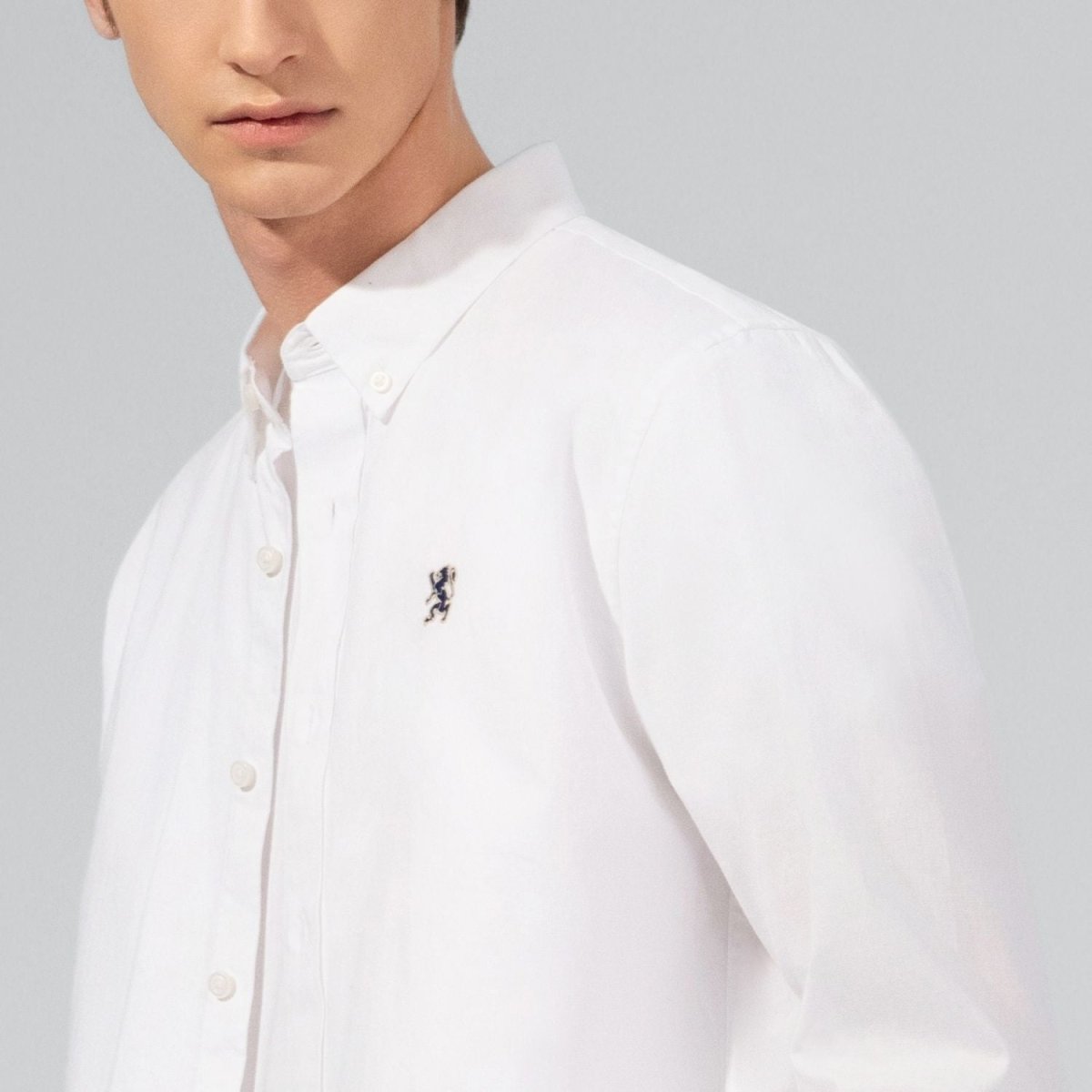 Giordano white oxford shirt with lion embroidery on chest and button-down collar